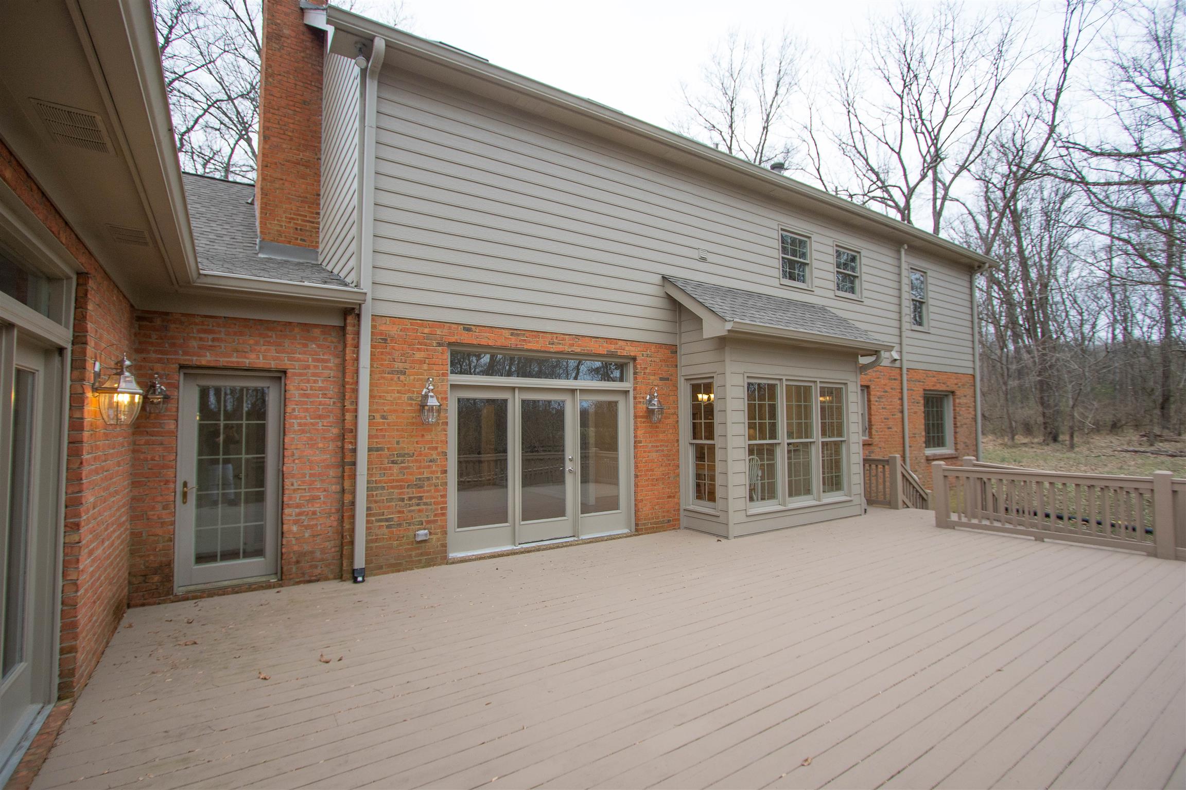 4304 Warren Road Franklin, TN 37067 - Photo 28 of 30 a view of a house with large windows and a tree