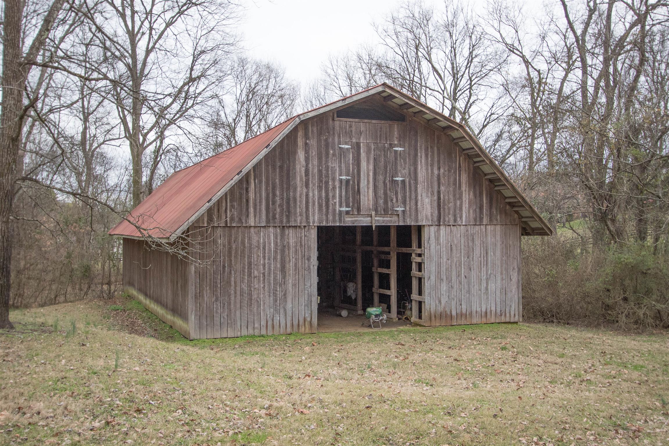 4304 Warren Road Franklin, TN 37067 - Photo 30 of 30 a backyard of a house with lots of trees