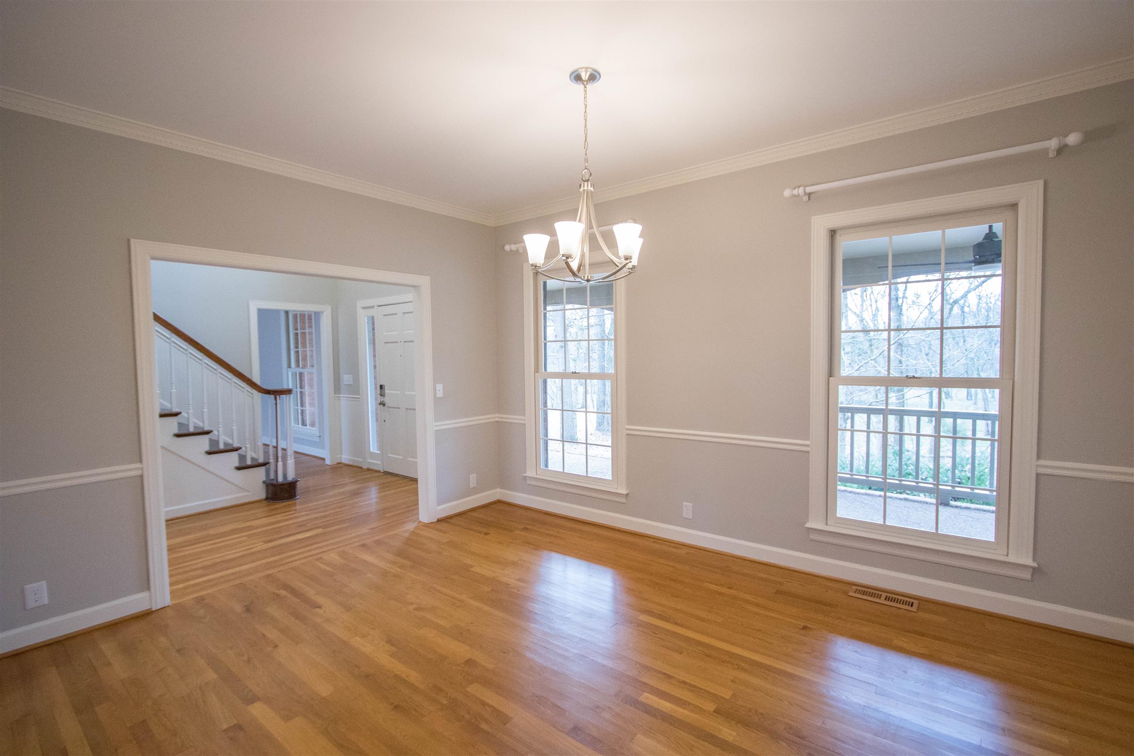 4304 Warren Road Franklin, TN 37067 - Photo 5 of 30 an empty room with wooden floor and windows
