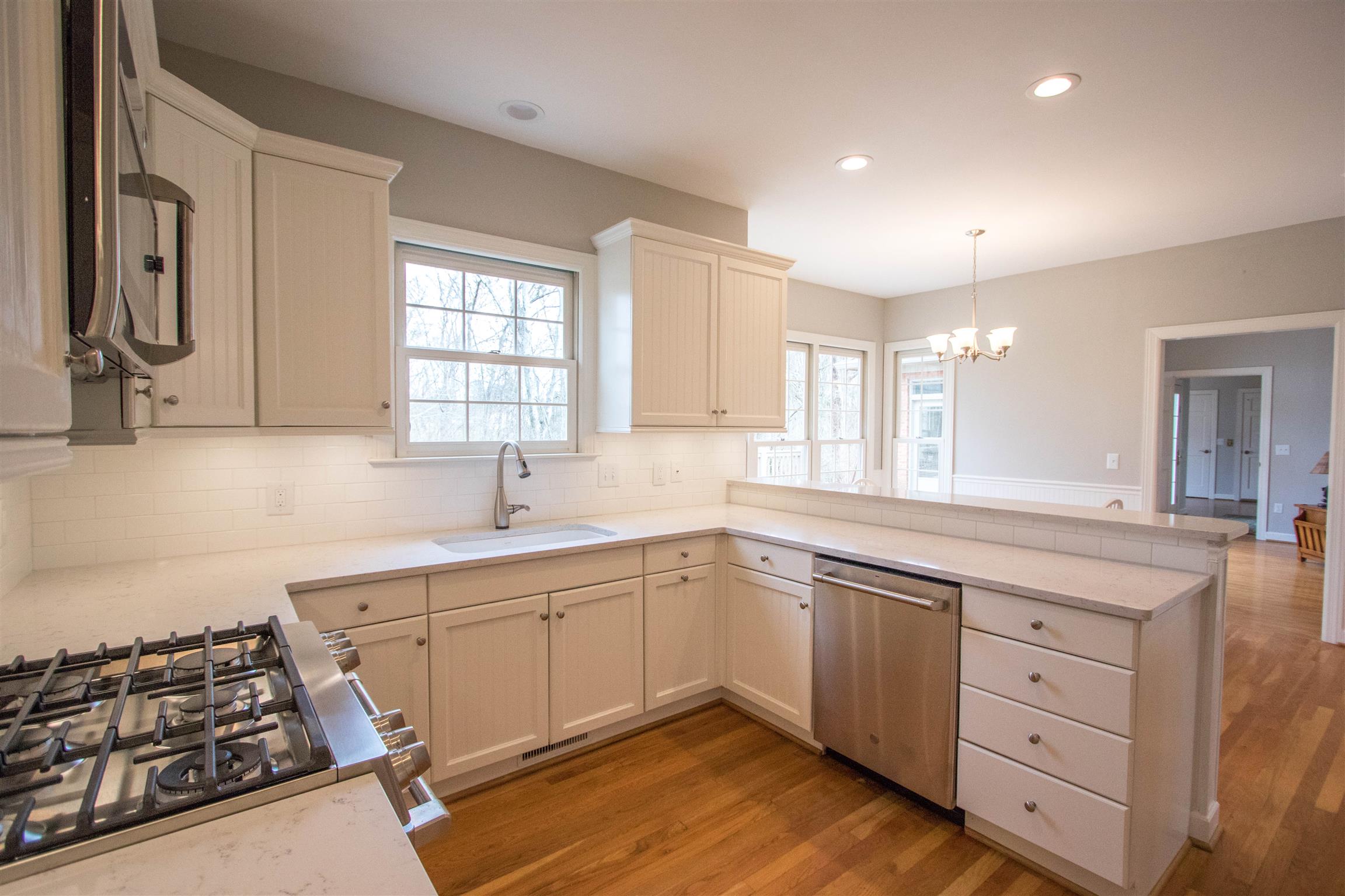 4304 Warren Road Franklin, TN 37067 - Photo 7 of 30 a kitchen with white cabinets and appliances