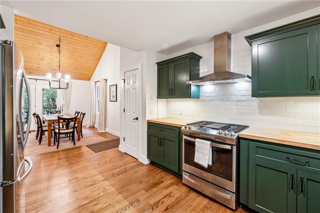 43 Morgan Walk Jasper, GA 30143 - Photo 12 of 55 a kitchen with stainless steel appliances granite countertop a stove a sink and a microwave