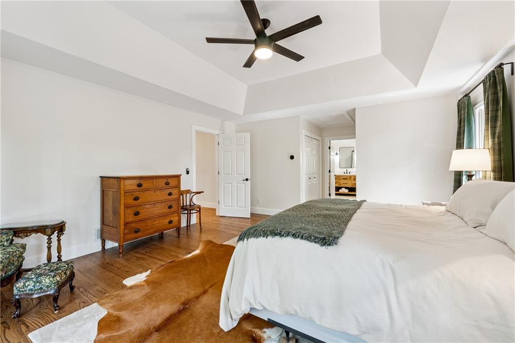 43 Morgan Walk Jasper, GA 30143 - Photo 18 of 55 a spacious bedroom with a bed and a chandelier