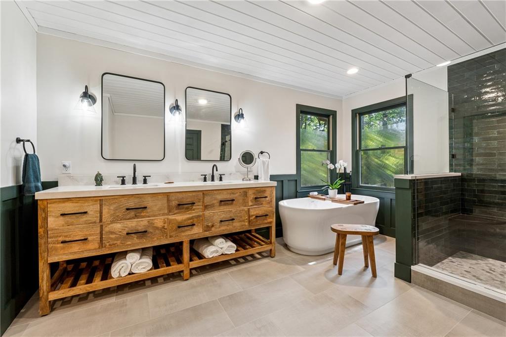 43 Morgan Walk Jasper, GA 30143 - Photo 19 of 55 a spacious bathroom with a double vanity sink tub and a mirror