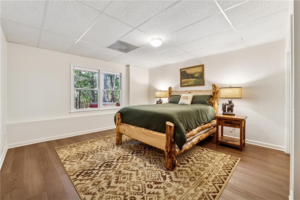 43 Morgan Walk Jasper, GA 30143 - Photo 25 of 55 a bedroom with a bed wooden floor and a window