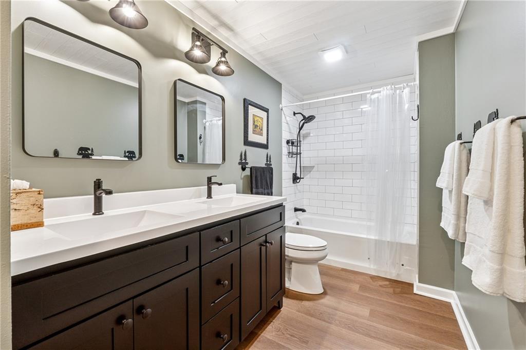 43 Morgan Walk Jasper, GA 30143 - Photo 32 of 55 a bathroom with a double vanity sink toilet mirror and shower