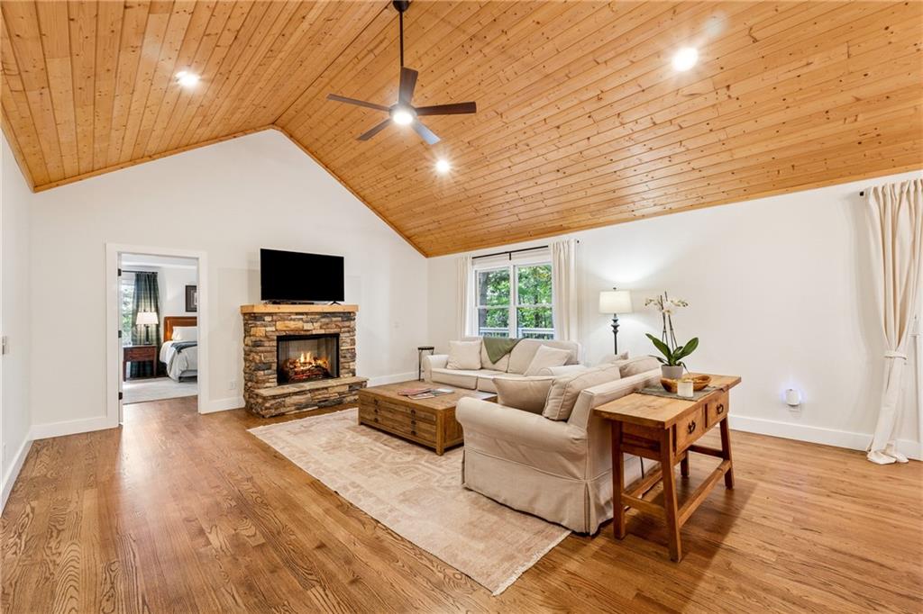 43 Morgan Walk Jasper, GA 30143 - Photo 8 of 55 a living room with furniture a fireplace and a flat screen tv
