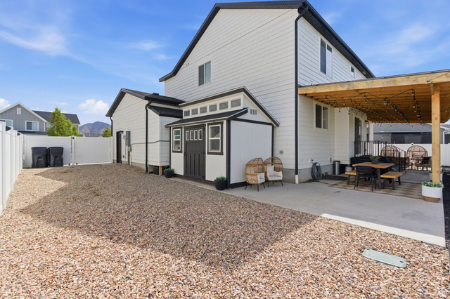 596 South Meade Street Mapleton, UT 84664 - Photo 33 of 38 Back of house with outdoor dining space, a fenced backyard, and a patio