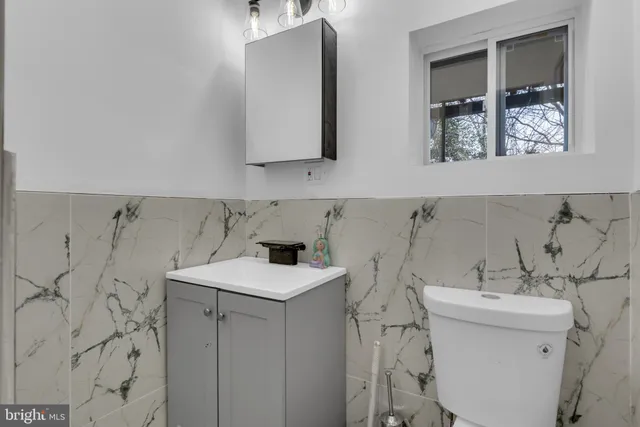 a utility room with cabinets washer and dryer