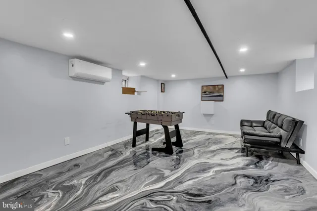 a living room with furniture and white walls