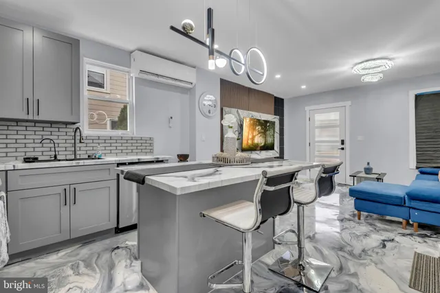 a view of a kitchen area kitchen island dining table and chairs