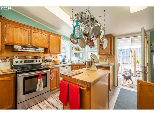 a dining area with furniture and a kitchen