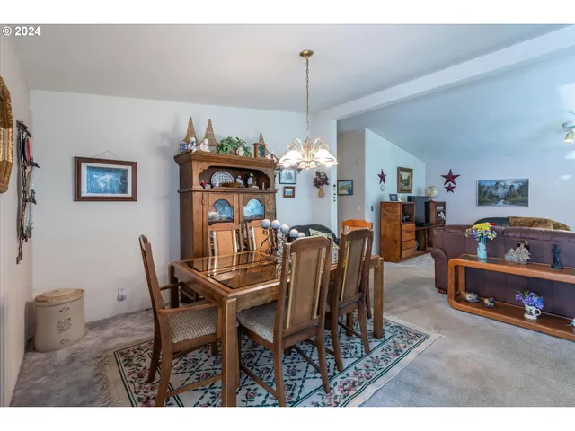 a living room with furniture a rug and a window