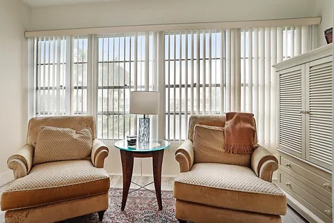 a work room with furniture and a window