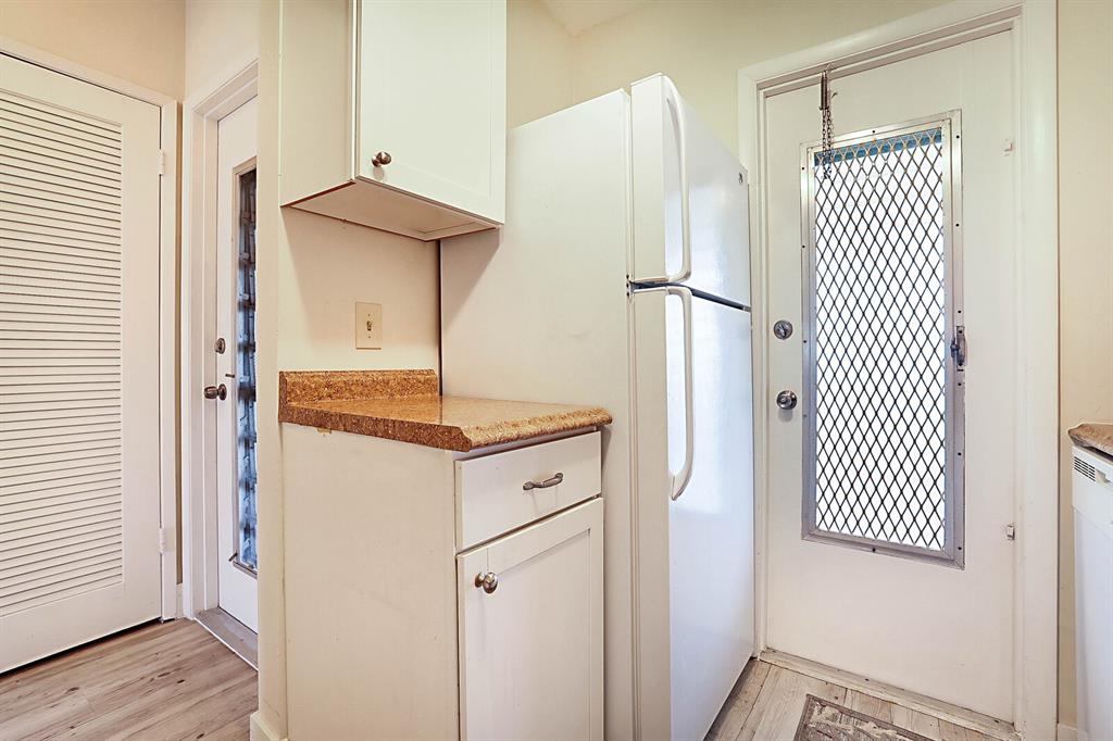 1951 Northeast 39th Street, Unit 343 Lighthouse Point, FL 33064 - Photo 17 of 28 a kitchen with a refrigerator and a stove