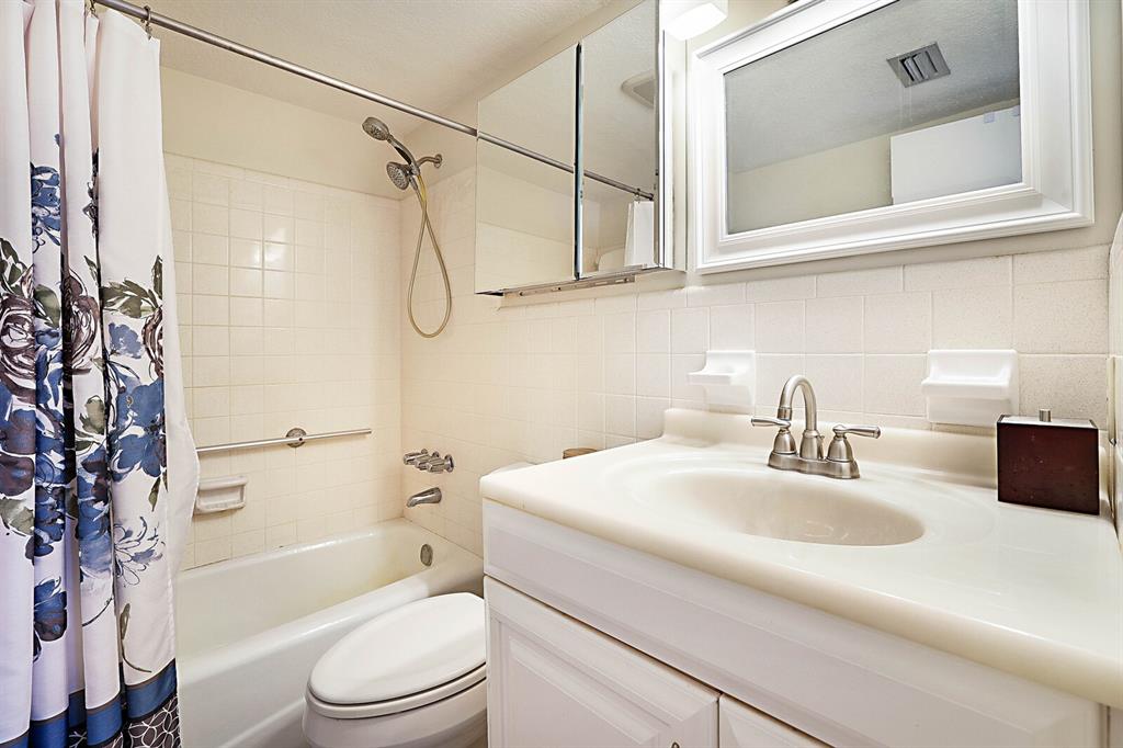 1951 Northeast 39th Street, Unit 343 Lighthouse Point, FL 33064 - Photo 23 of 28 a bathroom with a sink a toilet and shower