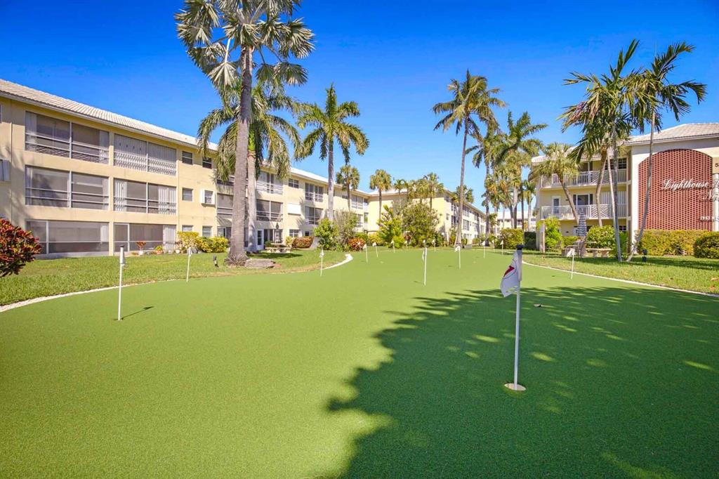 1951 Northeast 39th Street, Unit 343 Lighthouse Point, FL 33064 - Photo 26 of 28 a view of a palm trees