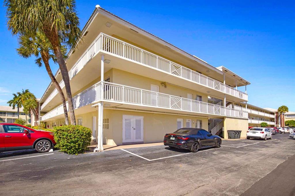 1951 Northeast 39th Street, Unit 343 Lighthouse Point, FL 33064 - Photo 27 of 28 a car parked in front of a building