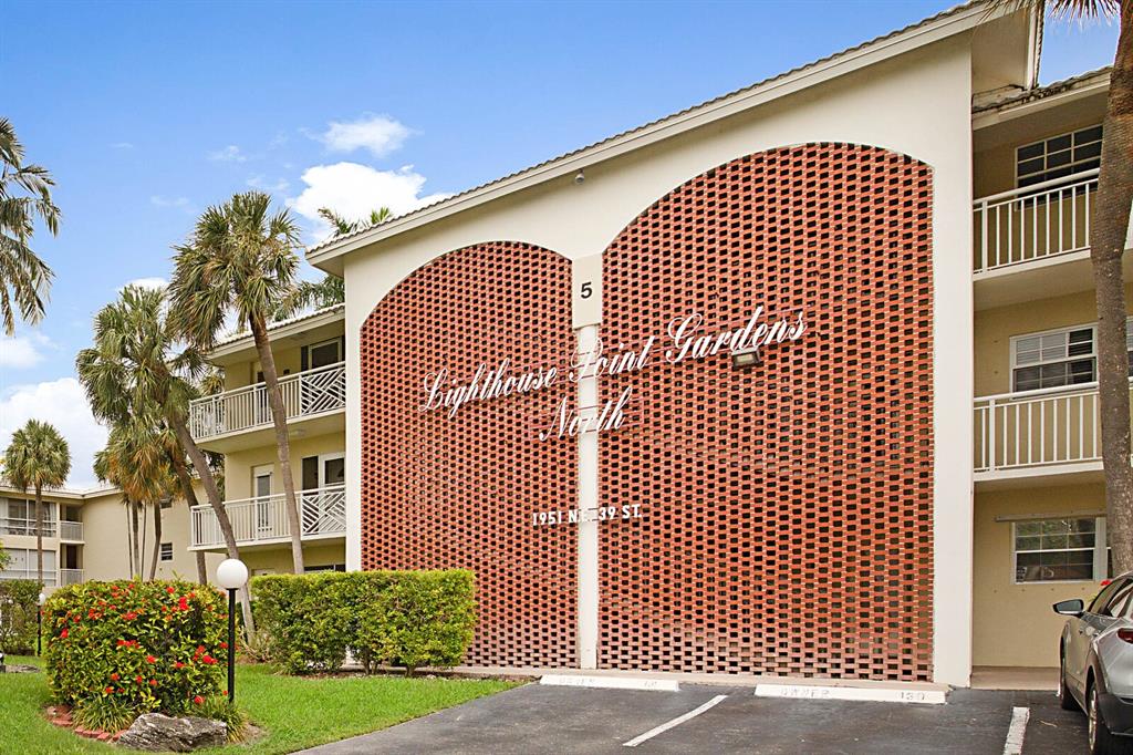1951 Northeast 39th Street, Unit 343 Lighthouse Point, FL 33064 - Photo 28 of 28 a front view of a building