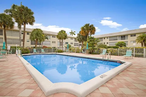 a view of a swimming pool with a patio