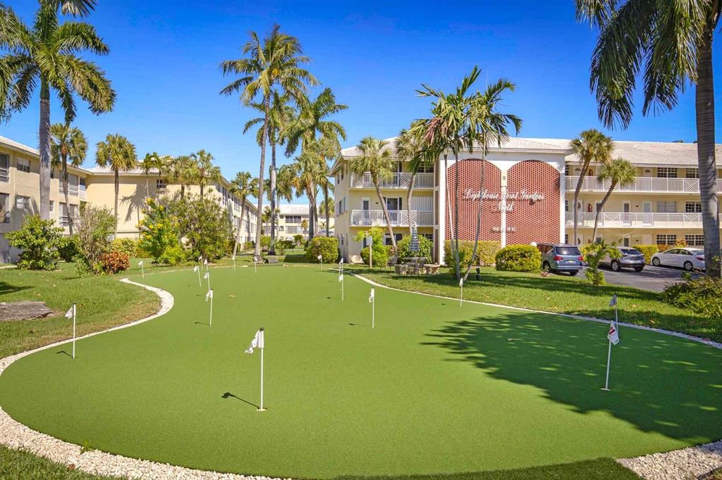 1951 Northeast 39th Street, Unit 343 Lighthouse Point, FL 33064 - Photo 4 of 28 a view of a house with a swimming pool
