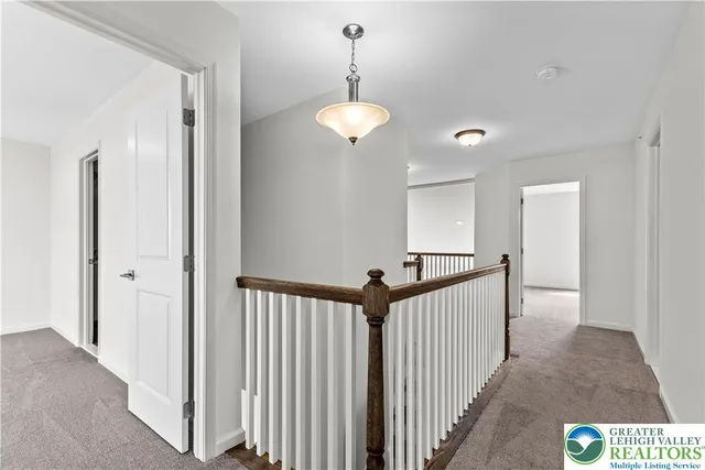 a view of a hallway with a chandelier