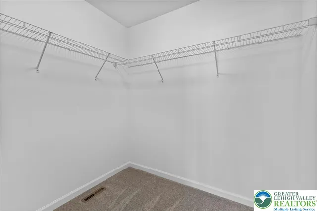 a view of a room with racks on the wall