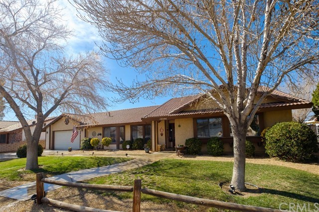 13544 Ivanpah Road Apple Valley, CA 92308 - Photo 1 of 1 a front view of a house with yard and green space
