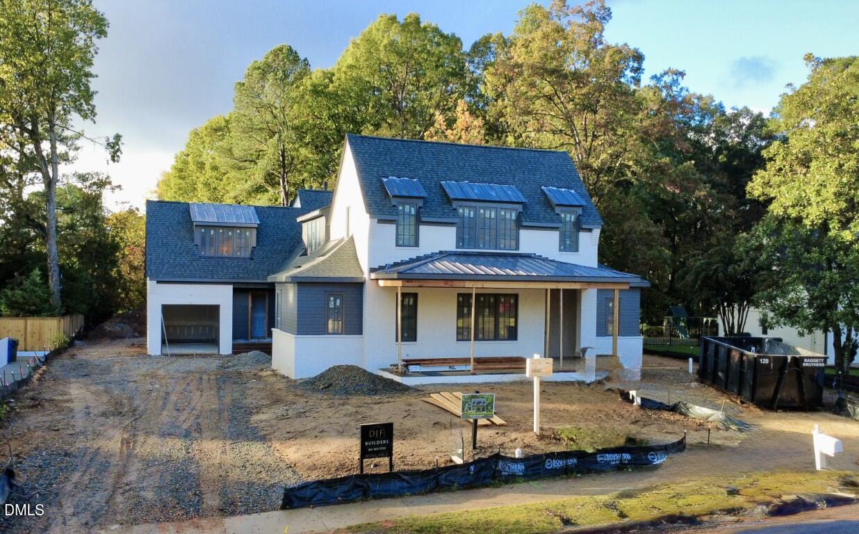 1412 Pony Run Road Raleigh, NC 27615 - Photo 2 of 42 a front view of a house with a yard