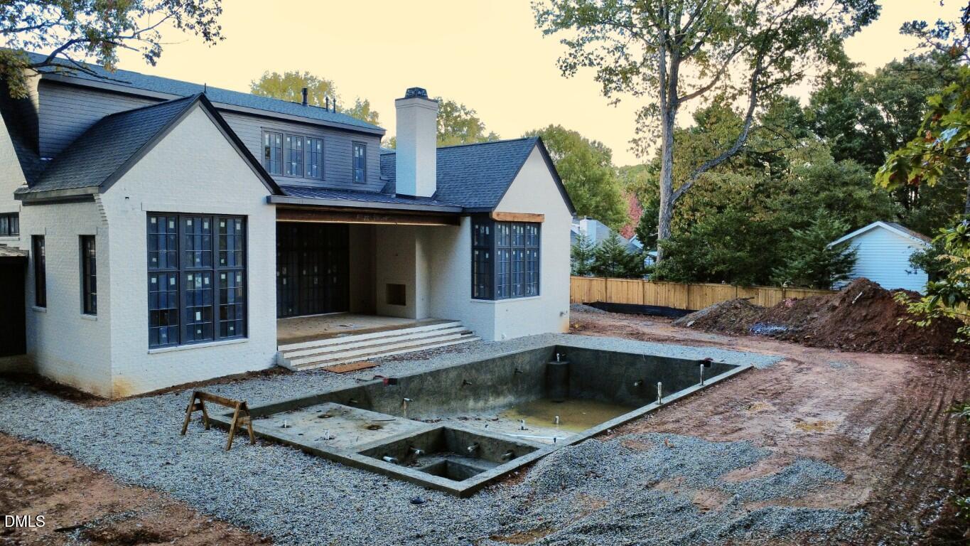 1412 Pony Run Road Raleigh, NC 27615 - Photo 42 of 42 a view of a house with backyard and sitting area