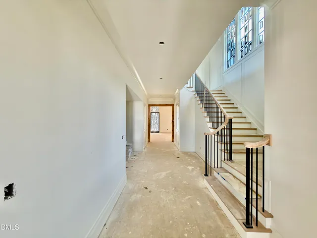 a view of a hallway with staircase