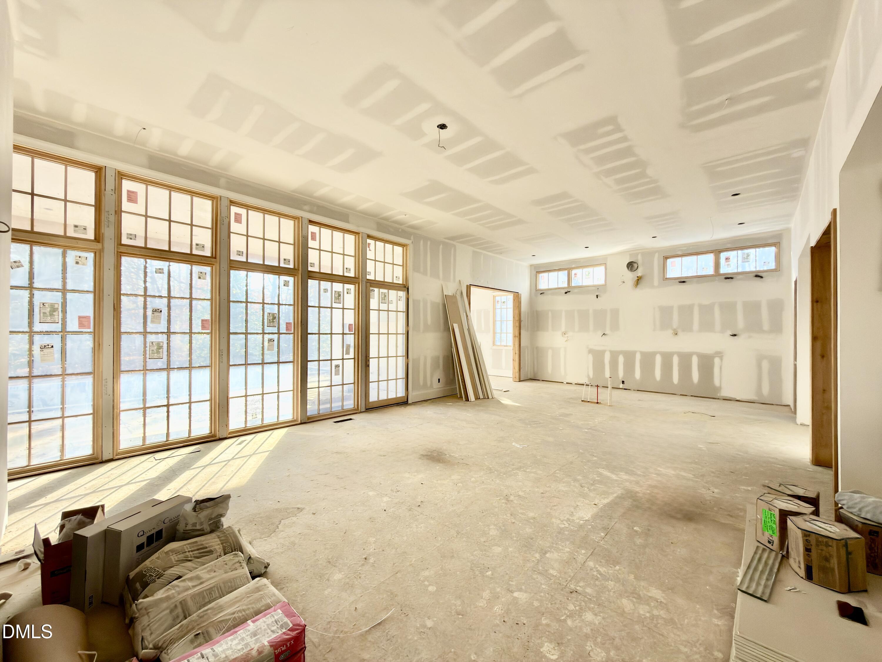 1412 Pony Run Road Raleigh, NC 27615 - Photo 7 of 42 a large bed sitting in a room next to a window