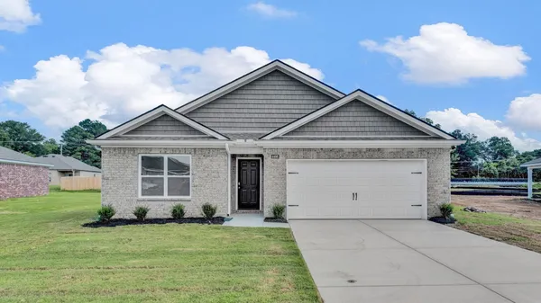 a view of a house with backyard