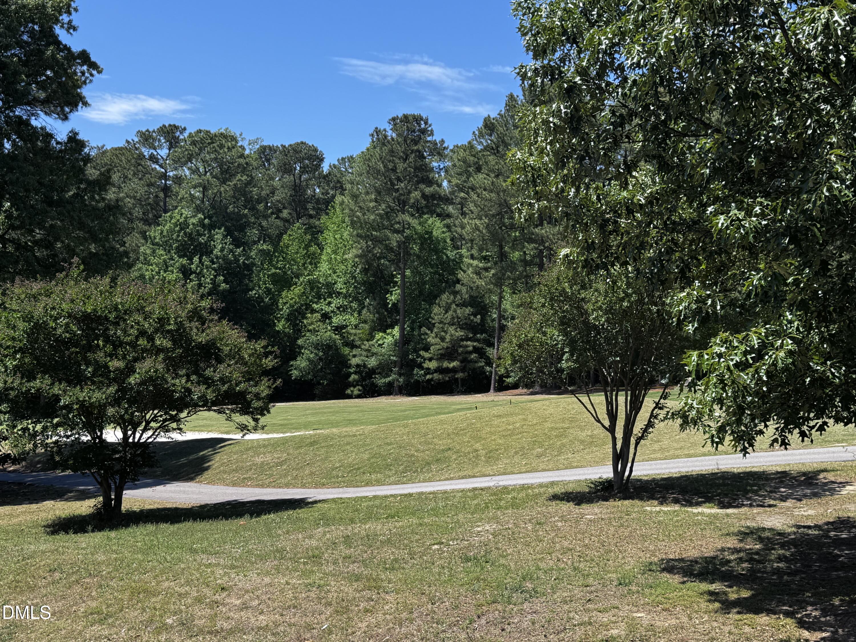 2212 Persimmon Ridge Drive Raleigh, NC 27604 - Photo 14 of 20 a view of a bench in a garden