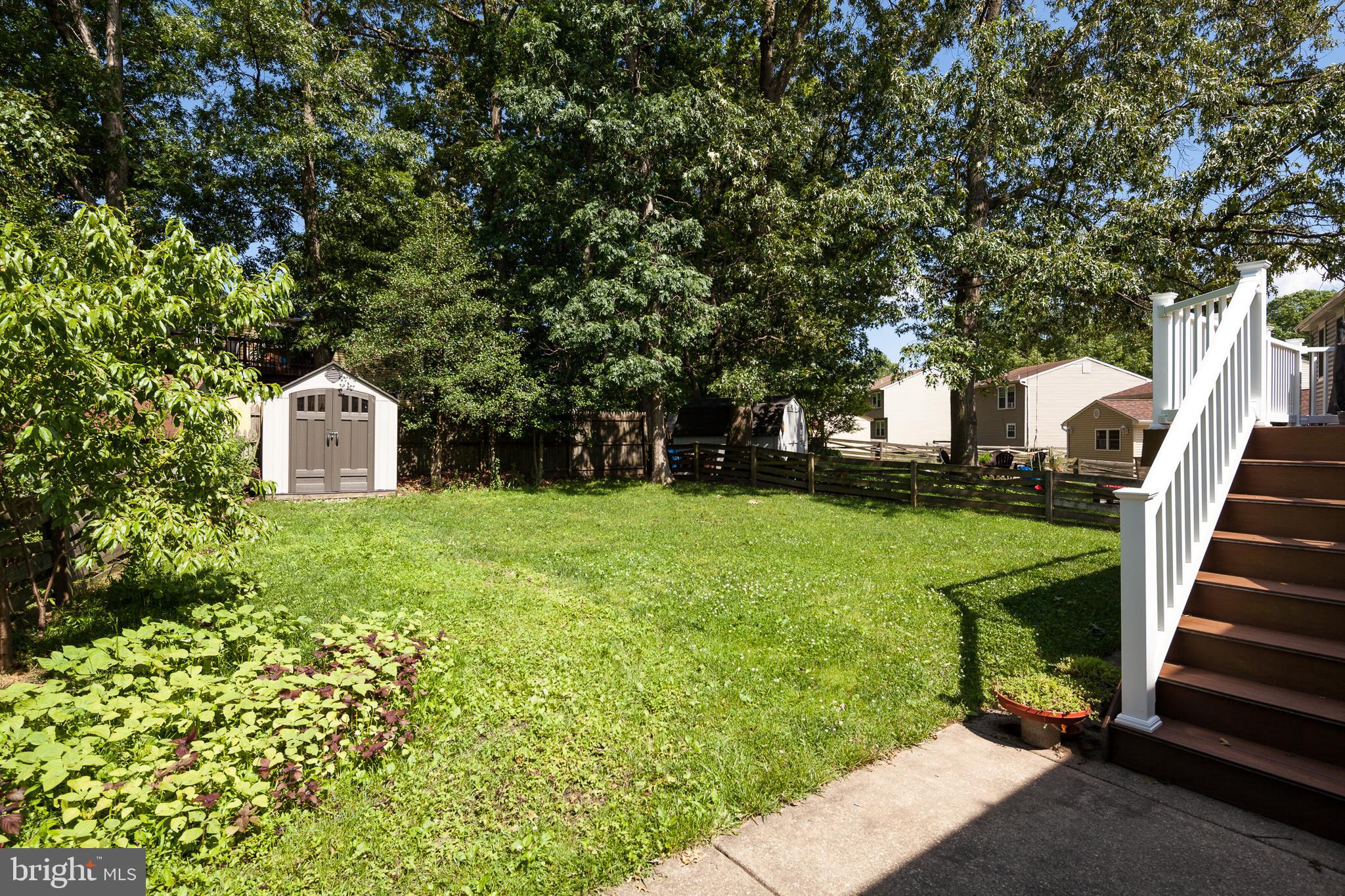 8521 Woodfall Road Baltimore, MD 21236 - Photo 19 of 21 REAR LAWN BACKS TO TREES