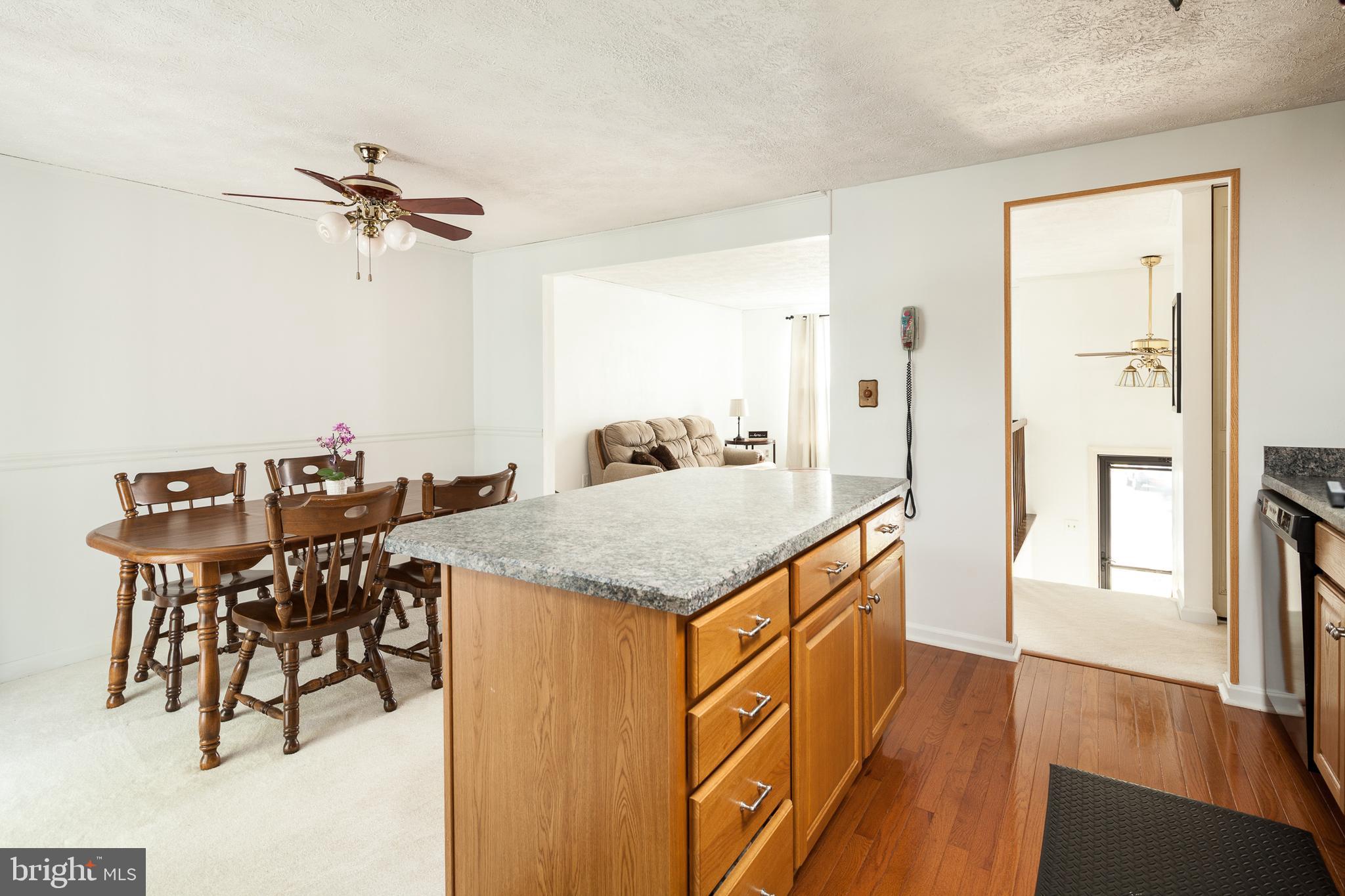 8521 Woodfall Road Baltimore, MD 21236 - Photo 7 of 21 KITCHEN OFFERS A SPACIOUS ISLAND/BREAKFAST BAR