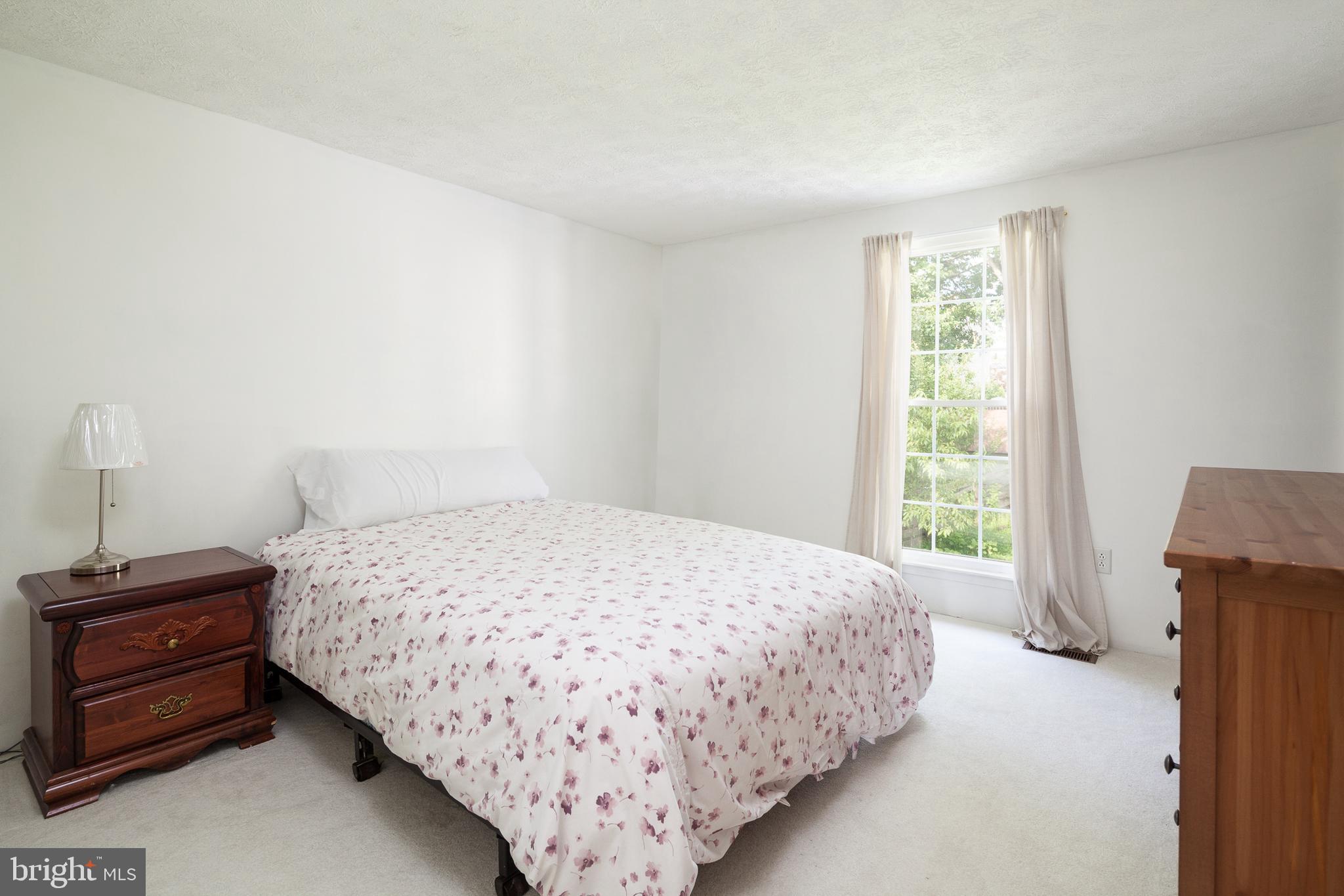 8521 Woodfall Road Baltimore, MD 21236 - Photo 8 of 21 MASTER BEDROOM WITH NEUTRAL CARPET