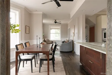 a view of a dining room with furniture and window
