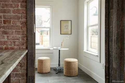 a room with a window and mirror