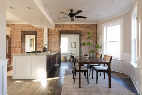 a view of a dining room with furniture window and wooden floor