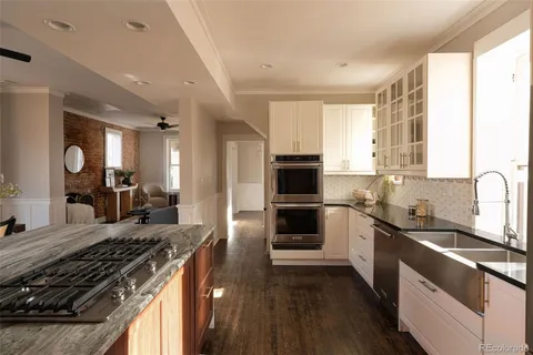 a kitchen with a sink stove and refrigerator