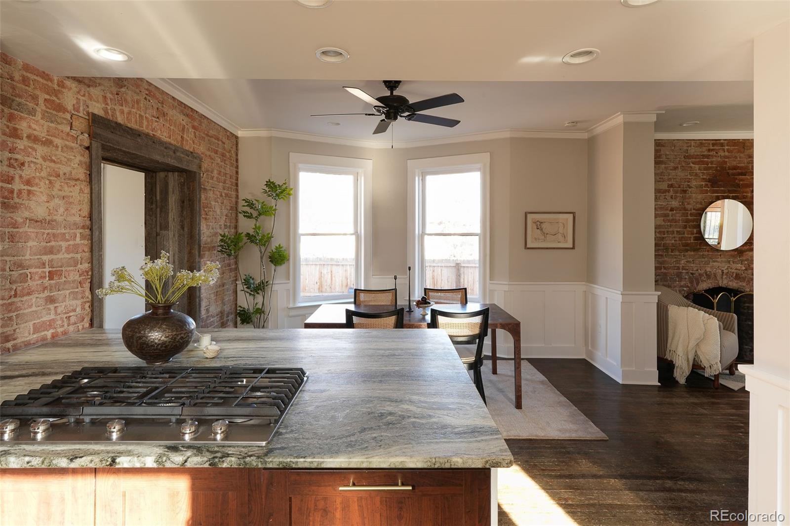 3365 Federal Boulevard Denver, CO 80211 - Photo 22 of 47 a view of a kitchen with dining table and chairs