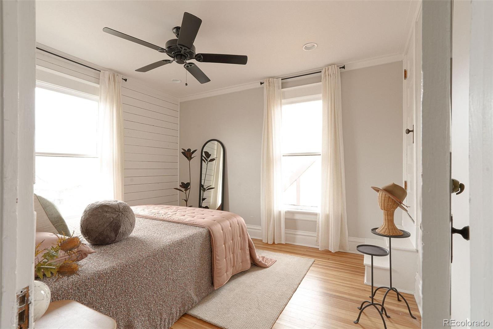 3365 Federal Boulevard Denver, CO 80211 - Photo 26 of 47 a bedroom with a bed and a window