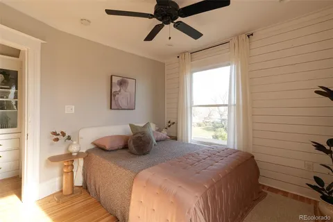 a bedroom with a bed and cabinets