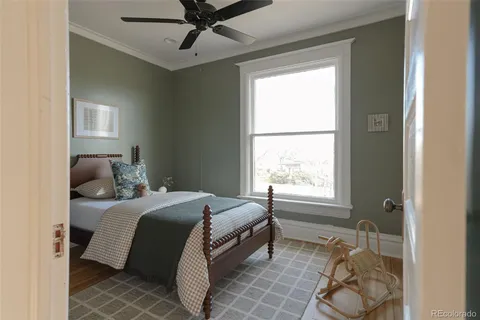 a bedroom with a bed and a lamp