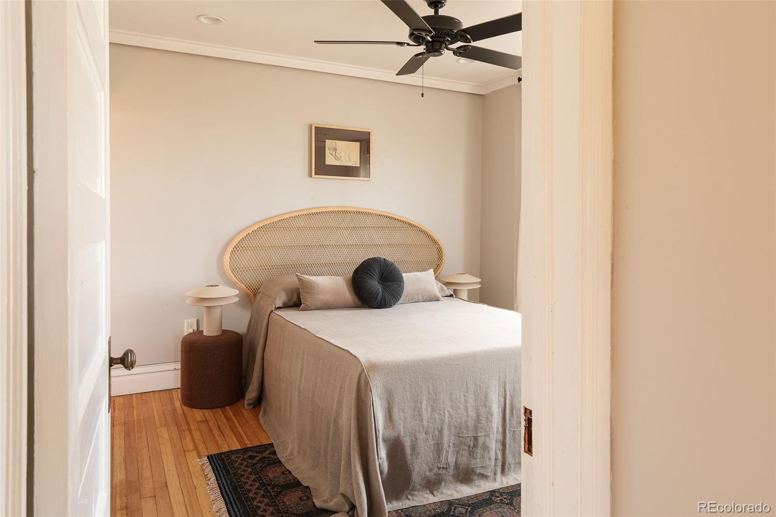 3365 Federal Boulevard Denver, CO 80211 - Photo 35 of 47 a bedroom with a bed and a painting on the wall