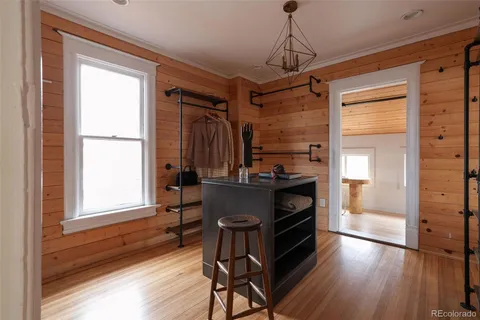 a view of a living room and bathroom with a sink