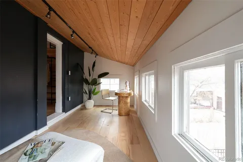 a front view of a house with garden and patio