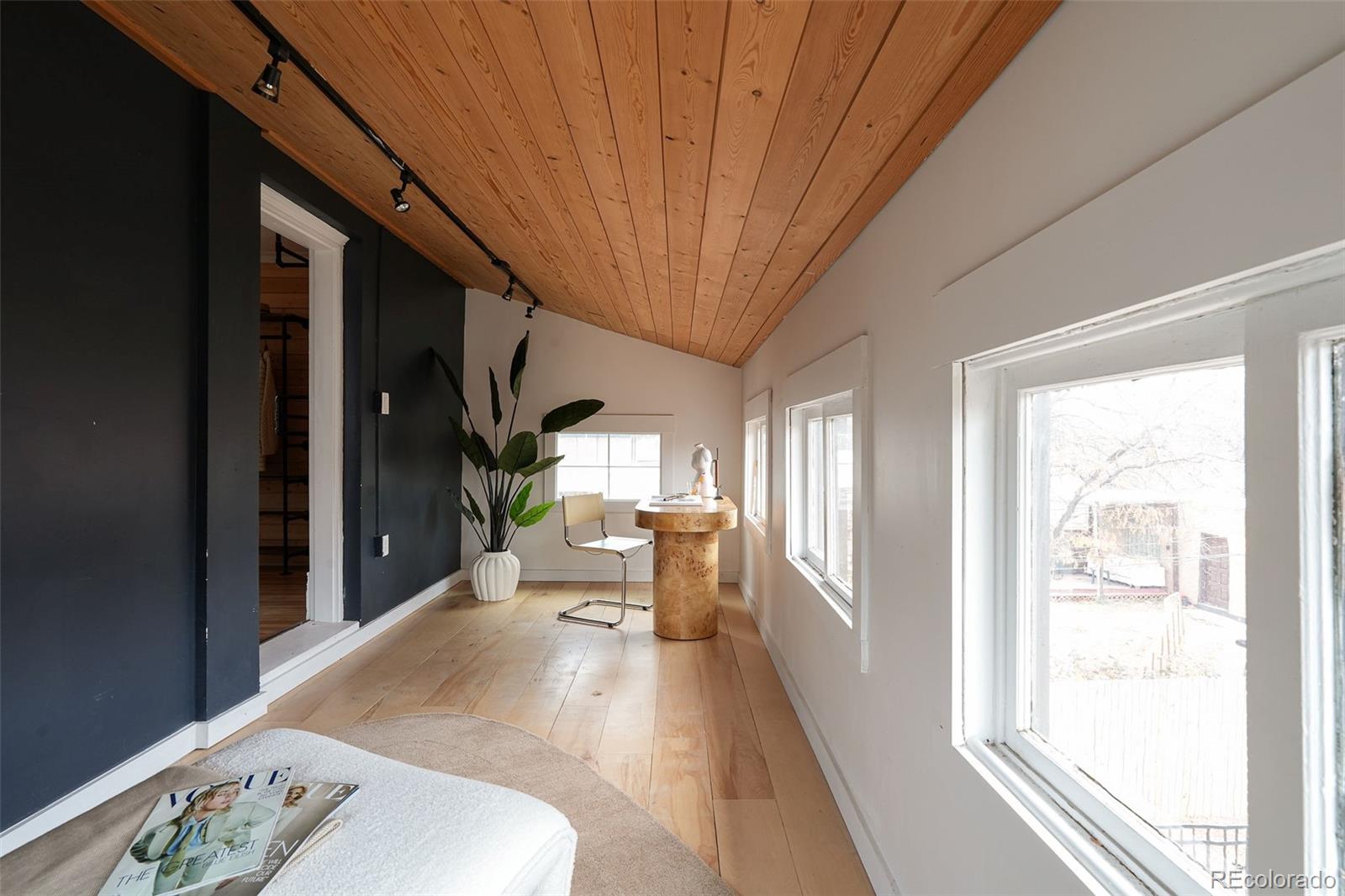 3365 Federal Boulevard Denver, CO 80211 - Photo 40 of 47 a view of a hallway with furniture and a window