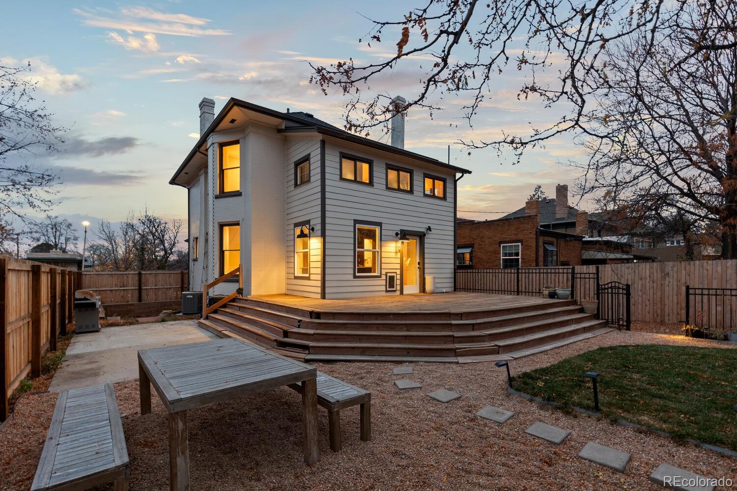 3365 Federal Boulevard Denver, CO 80211 - Photo 42 of 47 a front view of a house with garden and patio
