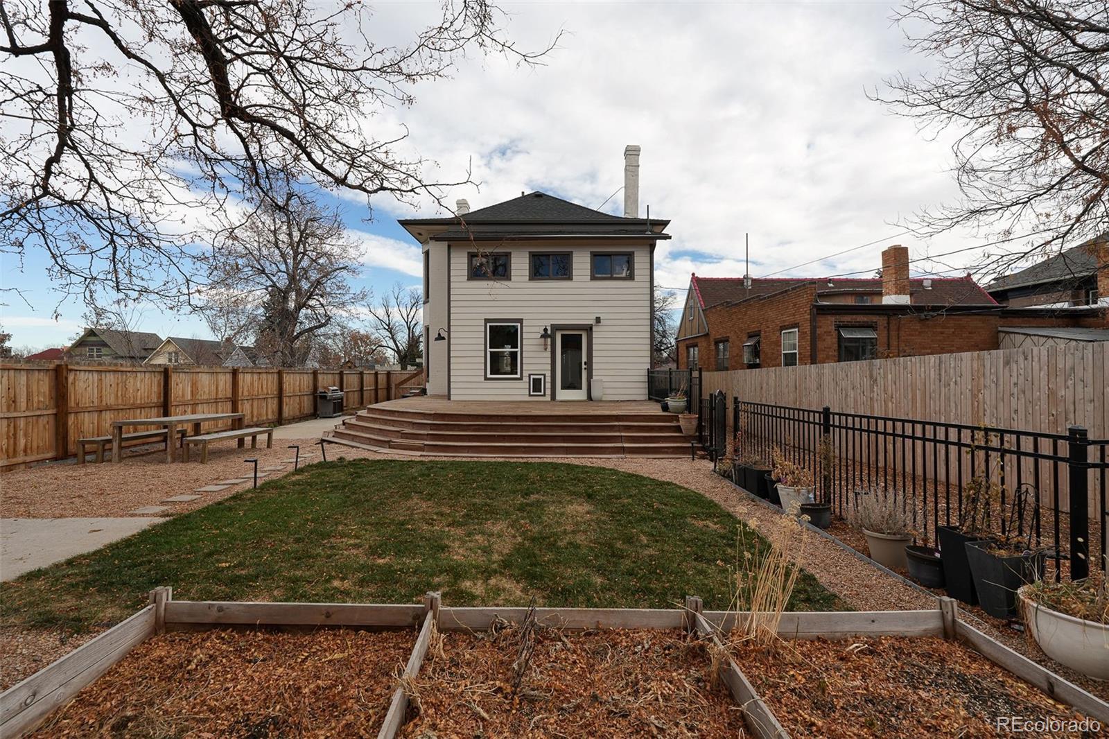 3365 Federal Boulevard Denver, CO 80211 - Photo 45 of 47 a front view of a house with garden
